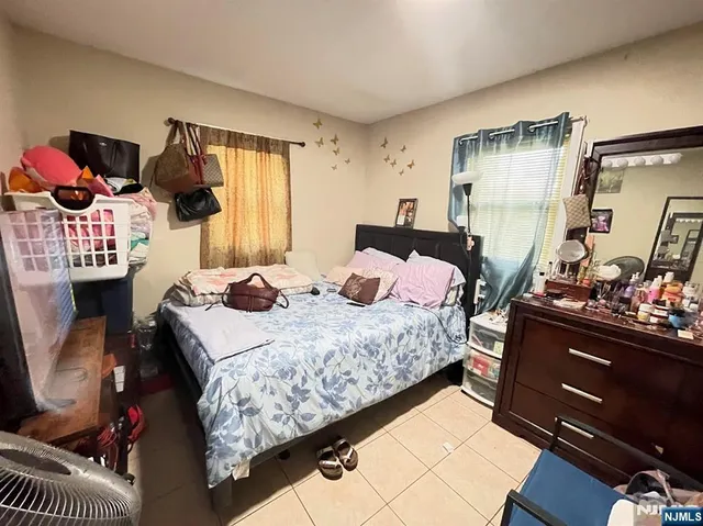 a bathroom with a sink vanity mirror bathtub and toilet