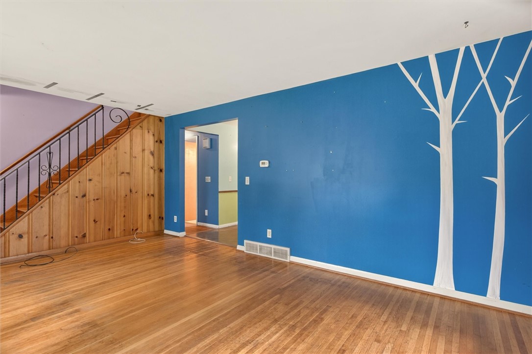 129 Browns Road Wheatland, NY 14546 - Photo 23 of 42 living room with view to kitchen and stairs to sec