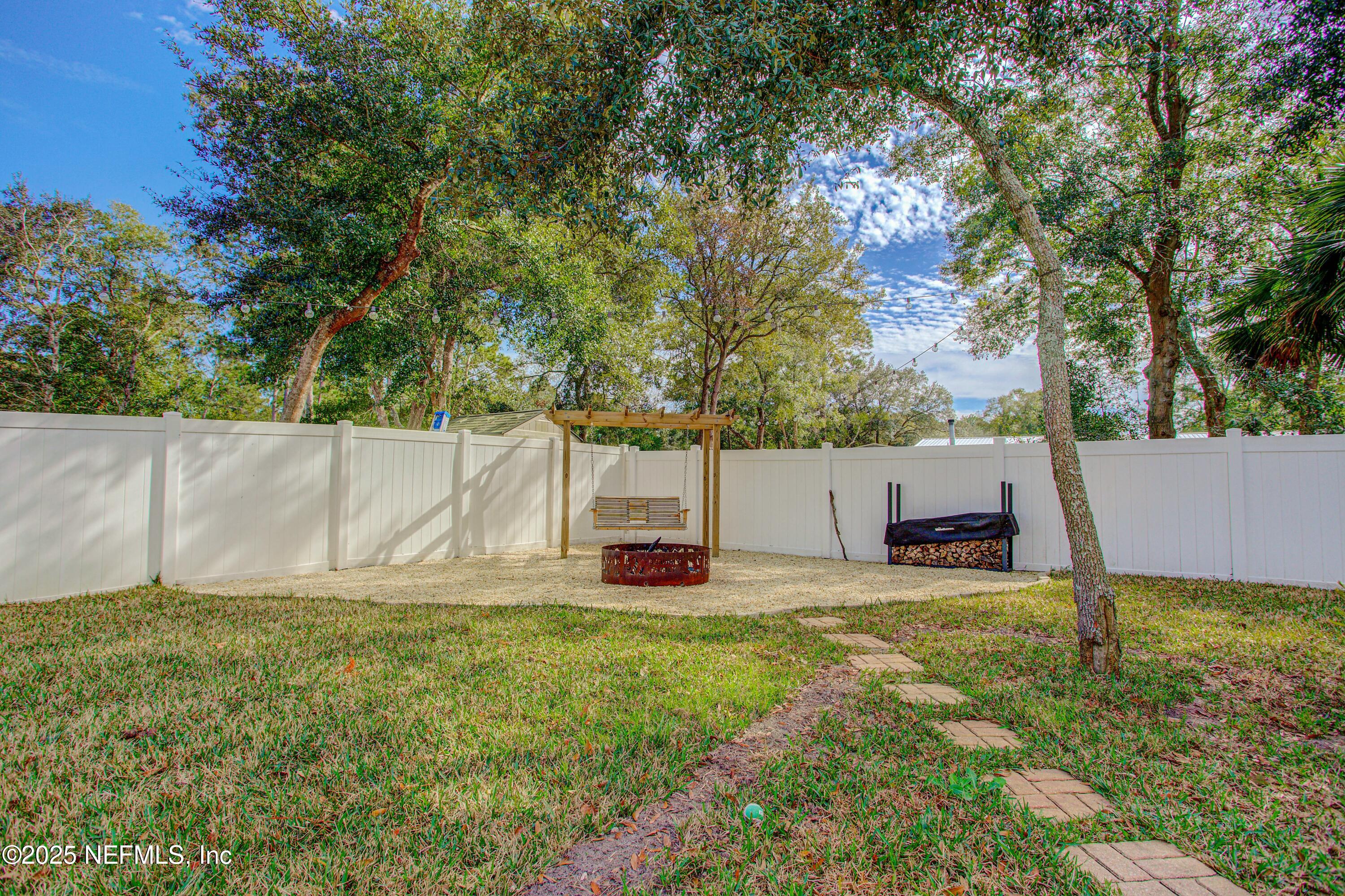 88083 Maybourne Road Yulee, FL 32097 - Photo 10 of 76 a view of a backyard