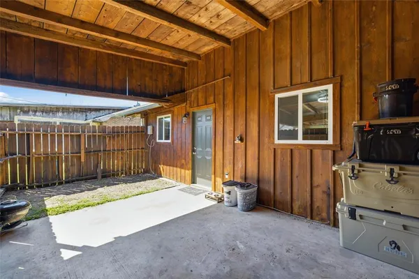 a view of backyard with tub and mirrors
