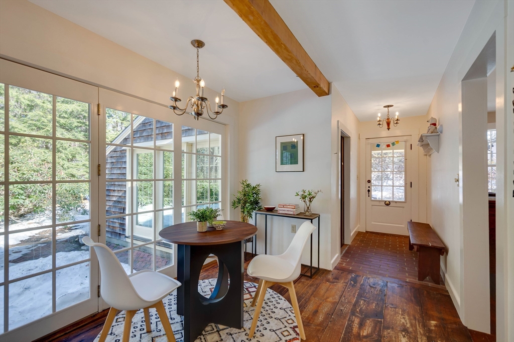 32 Pope Road Acton, MA 01720 - Photo 11 of 38 a view of a dining room with furniture window and wooden floor