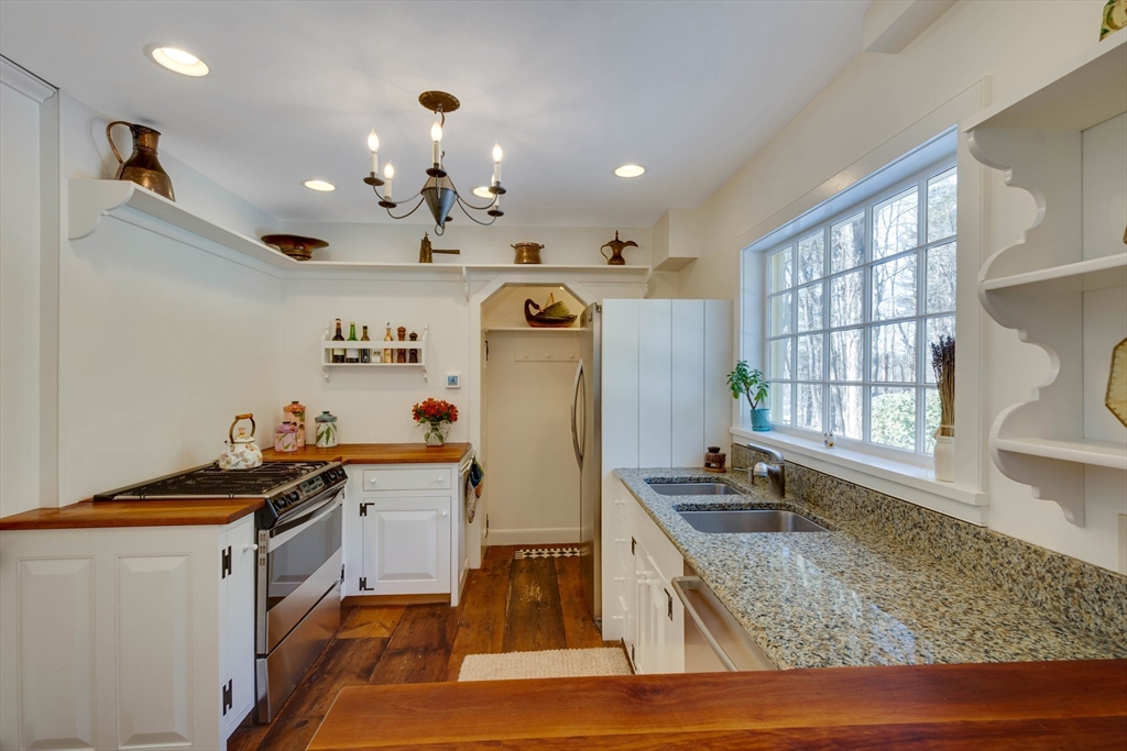 32 Pope Road Acton, MA 01720 - Photo 13 of 38 a kitchen that has a lot of windows and sink