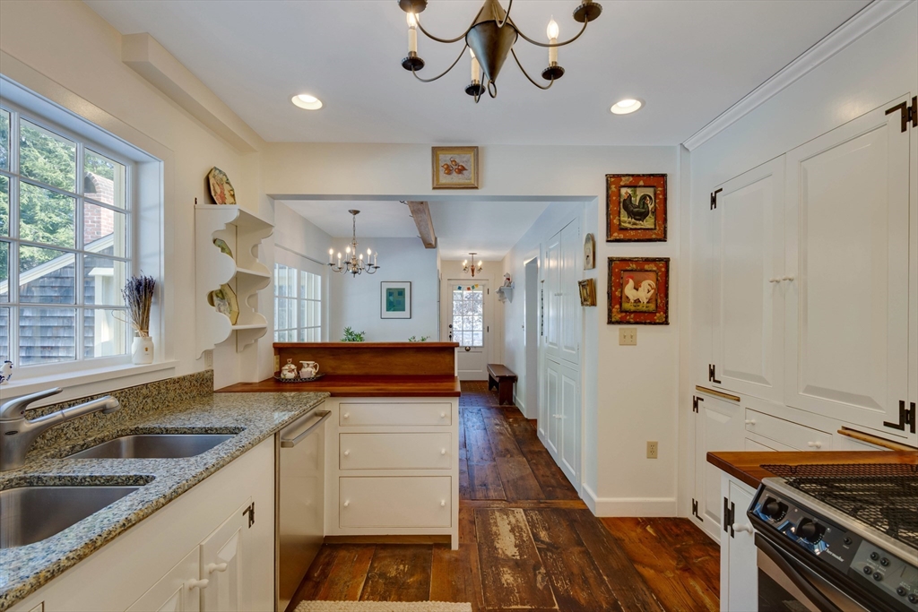 32 Pope Road Acton, MA 01720 - Photo 14 of 38 a kitchen with stainless steel appliances granite countertop a stove and cabinets
