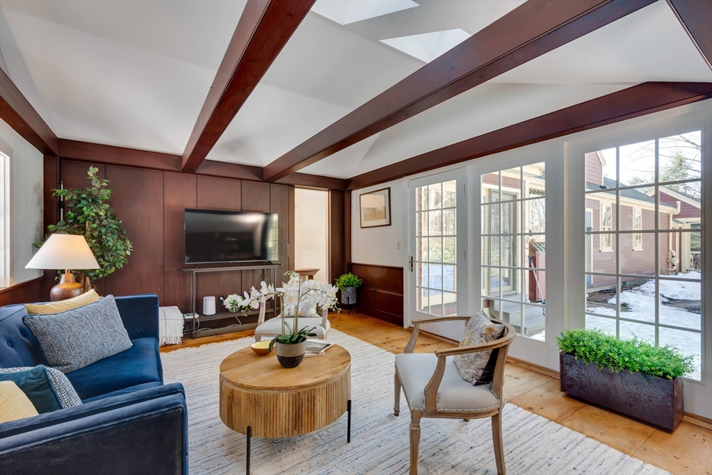 32 Pope Road Acton, MA 01720 - Photo 16 of 38 a living room with furniture and a flat screen tv