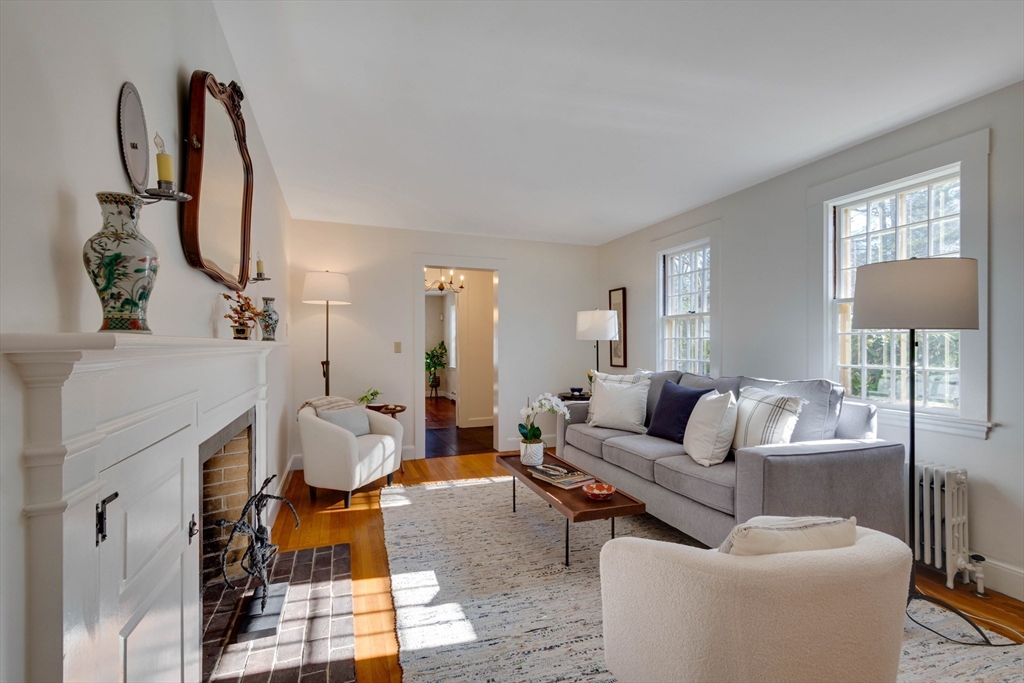 32 Pope Road Acton, MA 01720 - Photo 2 of 38 a living room with furniture a rug and a fireplace