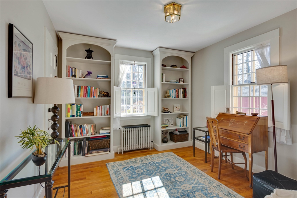 32 Pope Road Acton, MA 01720 - Photo 23 of 38 a living room with furniture and a book shelf