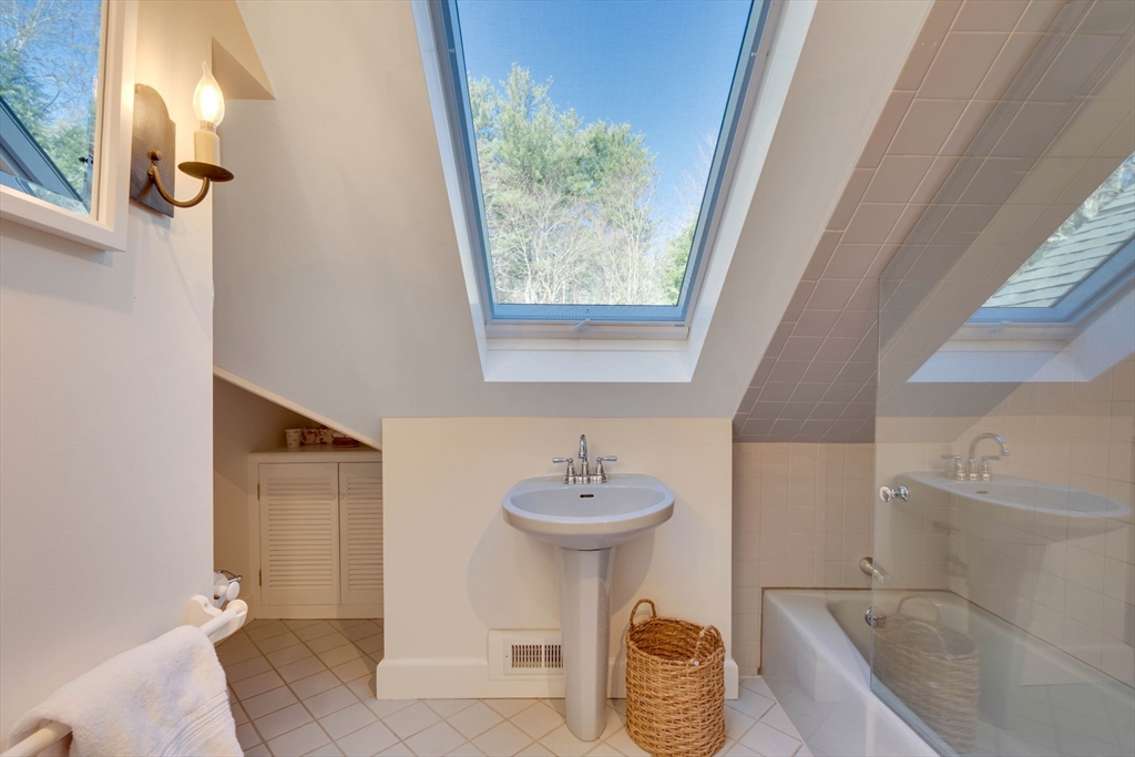 32 Pope Road Acton, MA 01720 - Photo 27 of 38 a bathroom with a sink a toilet and a mirror