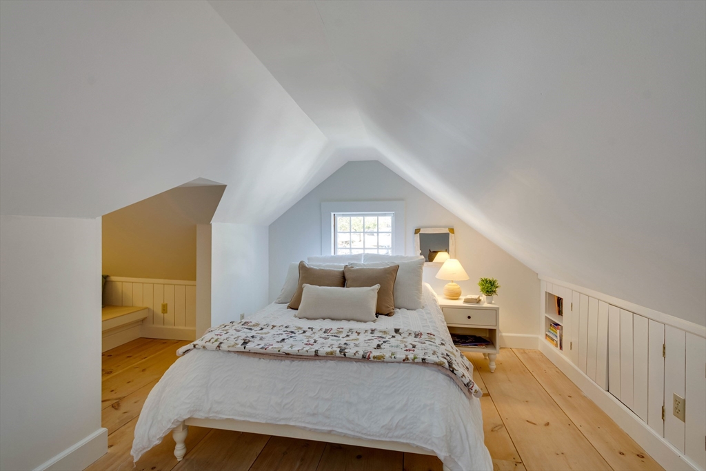 32 Pope Road Acton, MA 01720 - Photo 29 of 38 a bedroom with a bed and wooden floor