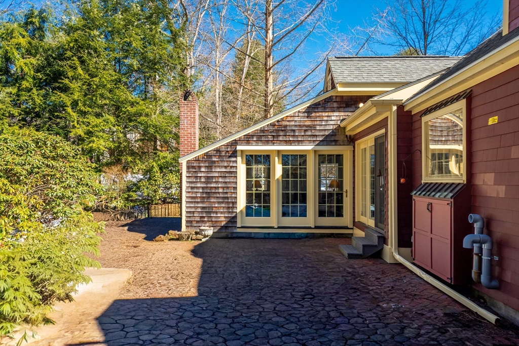 32 Pope Road Acton, MA 01720 - Photo 32 of 38 a front view of a house with a garden