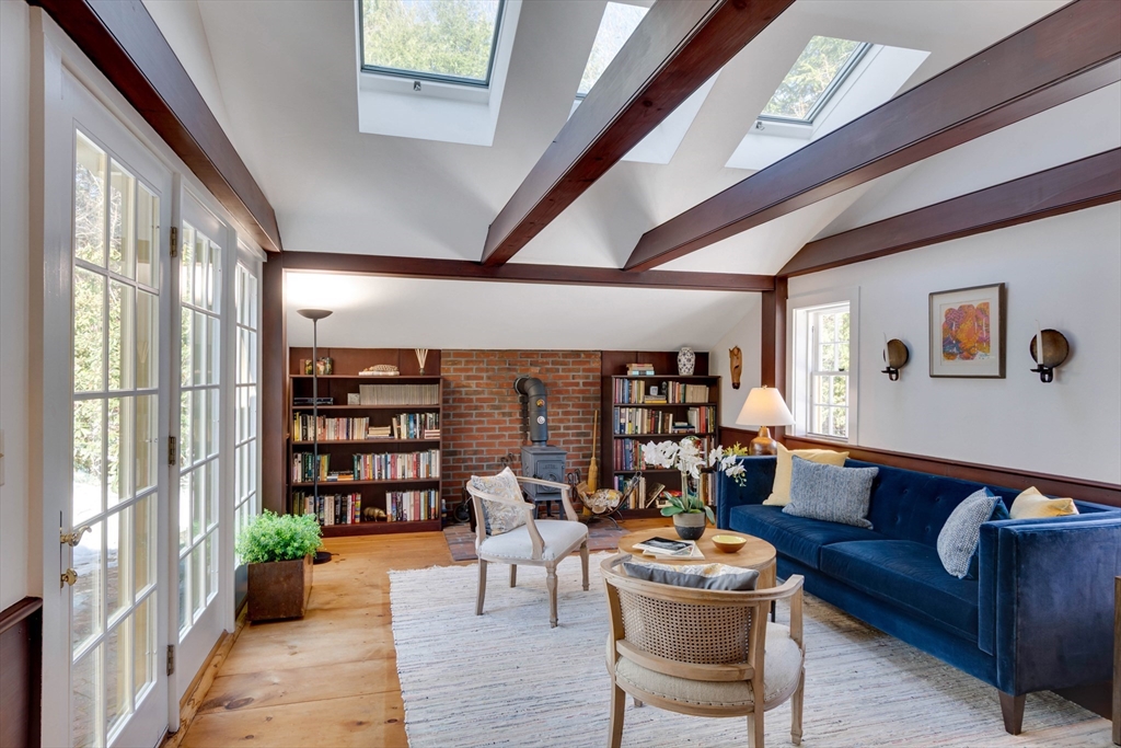 32 Pope Road Acton, MA 01720 - Photo 5 of 38 a living room with furniture and a book shelf