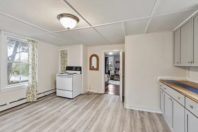 a kitchen with a refrigerator and a sink