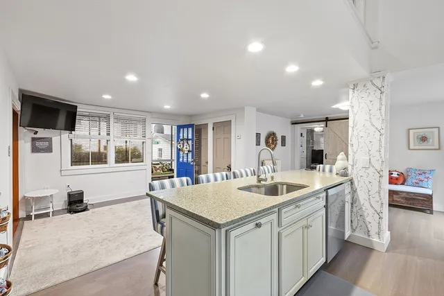 a kitchen with a stove a sink and a refrigerator