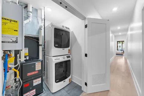 a view of a hallway with washer and dryer