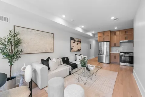 a living room with furniture and a large window