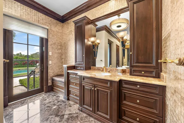 a view of a bathroom with sink and mirror