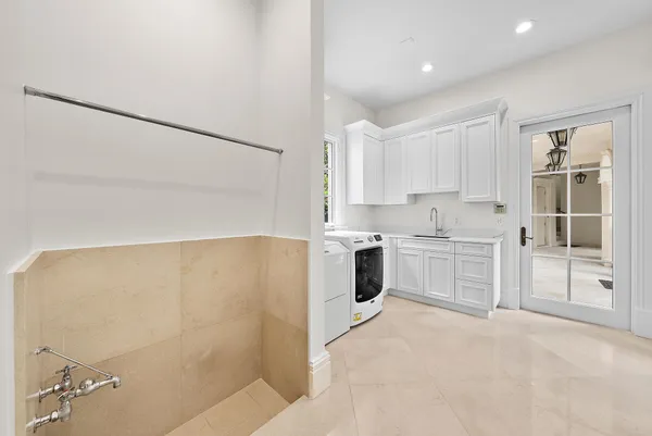 a bedroom with a bed next to a window