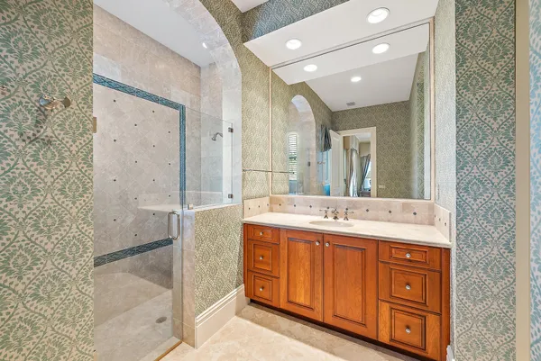 a bathroom with a sink and a large mirror