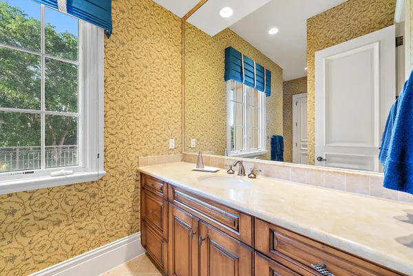 a bathroom with a sink and a mirror