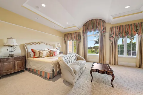 a spacious bedroom with two beds and a couch