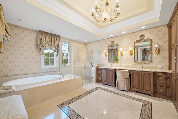 a kitchen with stainless steel appliances granite countertop a sink and a refrigerator