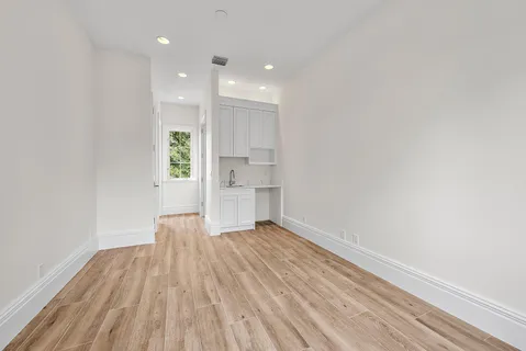 a room with furniture and a large window