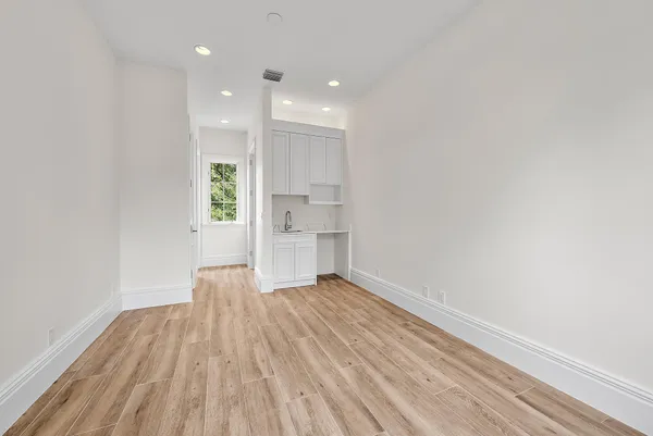 a room with furniture and a large window