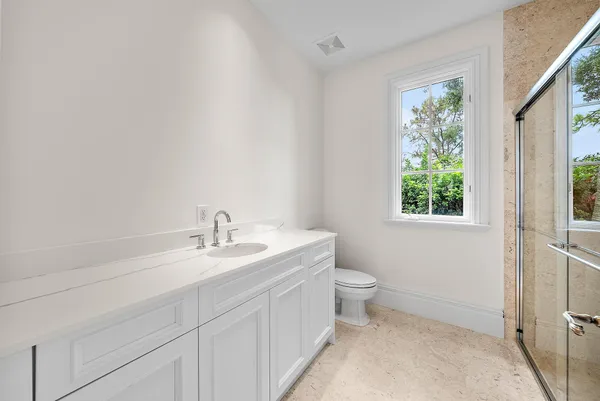 a white bath tub sitting next to a white sink