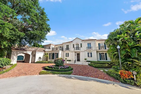 a view of a white house with a outdoor space
