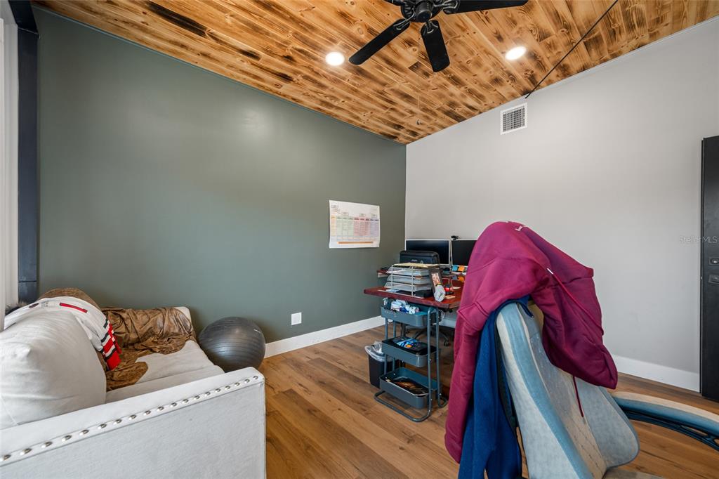 620 Union Street Dunedin, FL 34698 - Photo 13 of 45 a living room with furniture and a wooden floor