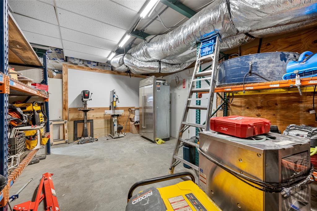 620 Union Street Dunedin, FL 34698 - Photo 31 of 45 a view of a storage room with a lot of stuff