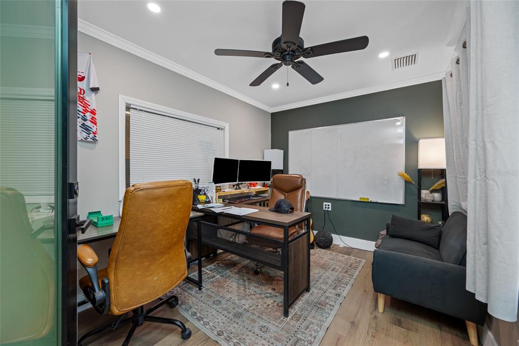 620 Union Street Dunedin, FL 34698 - Photo 10 of 45 a view of a livingroom with workspace and a couch