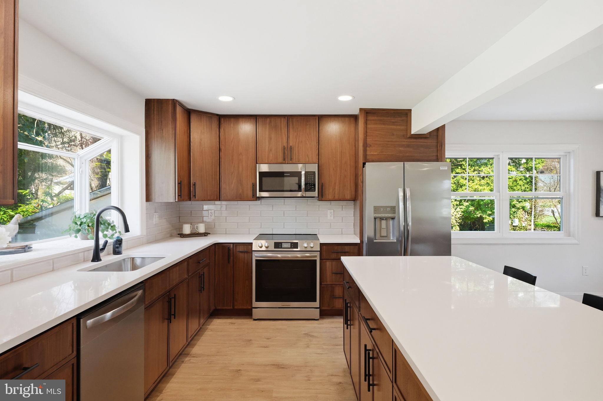 409 South Providence Road Wallingford, PA 19086 - Photo 36 of 106 Modern kitchen with warm wood tones.