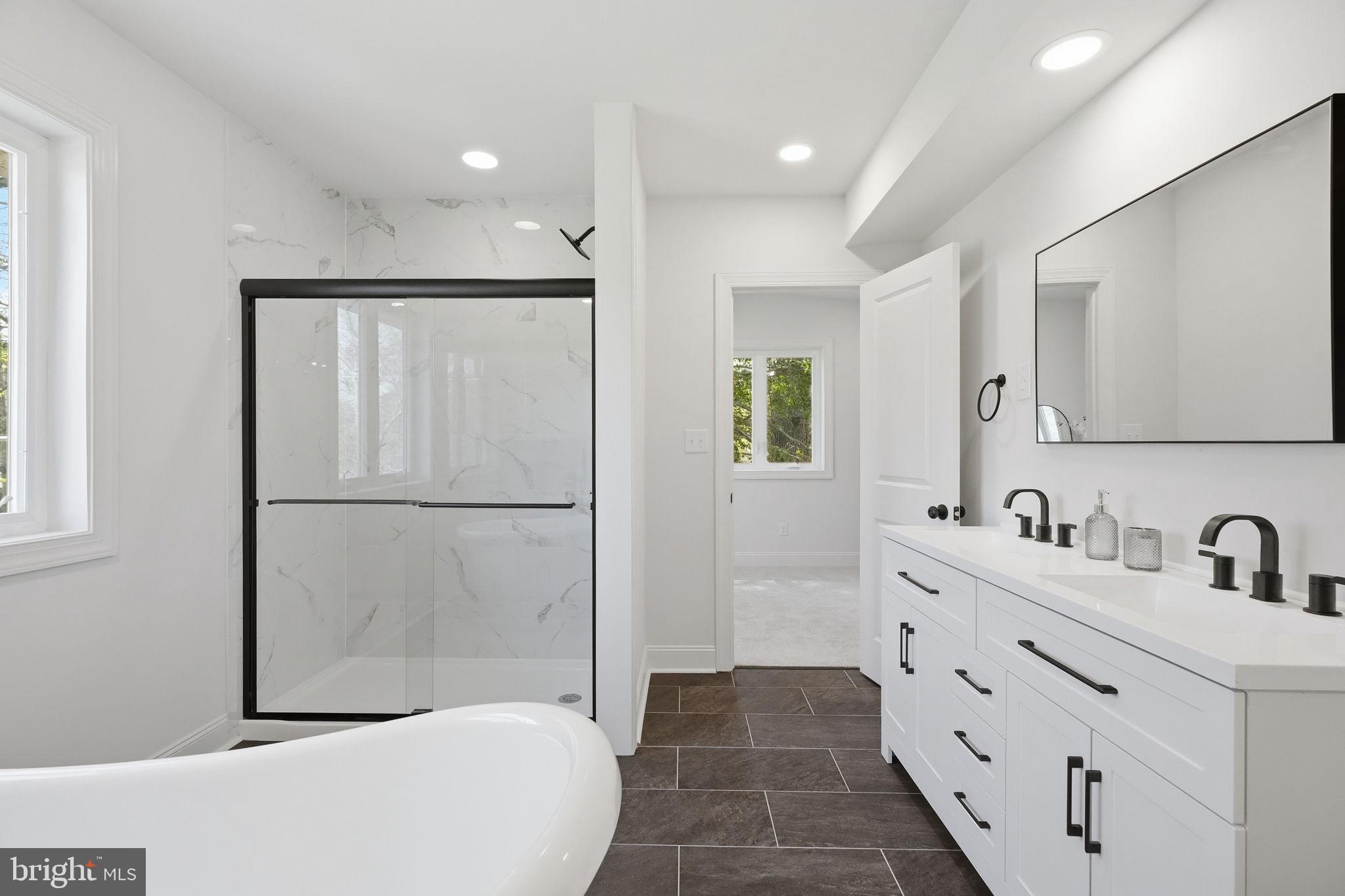 409 South Providence Road Wallingford, PA 19086 - Photo 76 of 106 Sleek modern bathroom oasis.