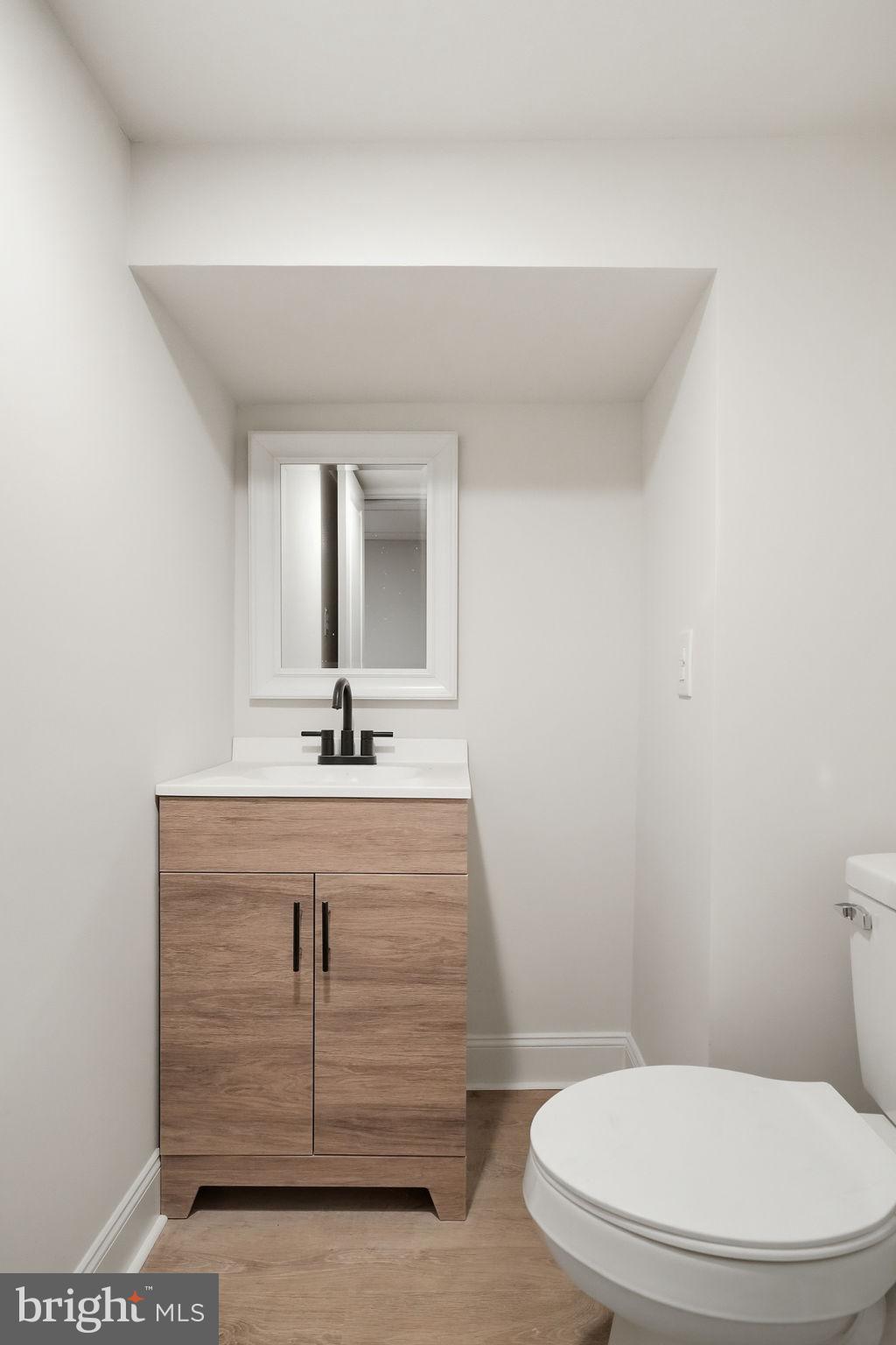 409 South Providence Road Wallingford, PA 19086 - Photo 84 of 106 Sleek and modern half-bath retreat.