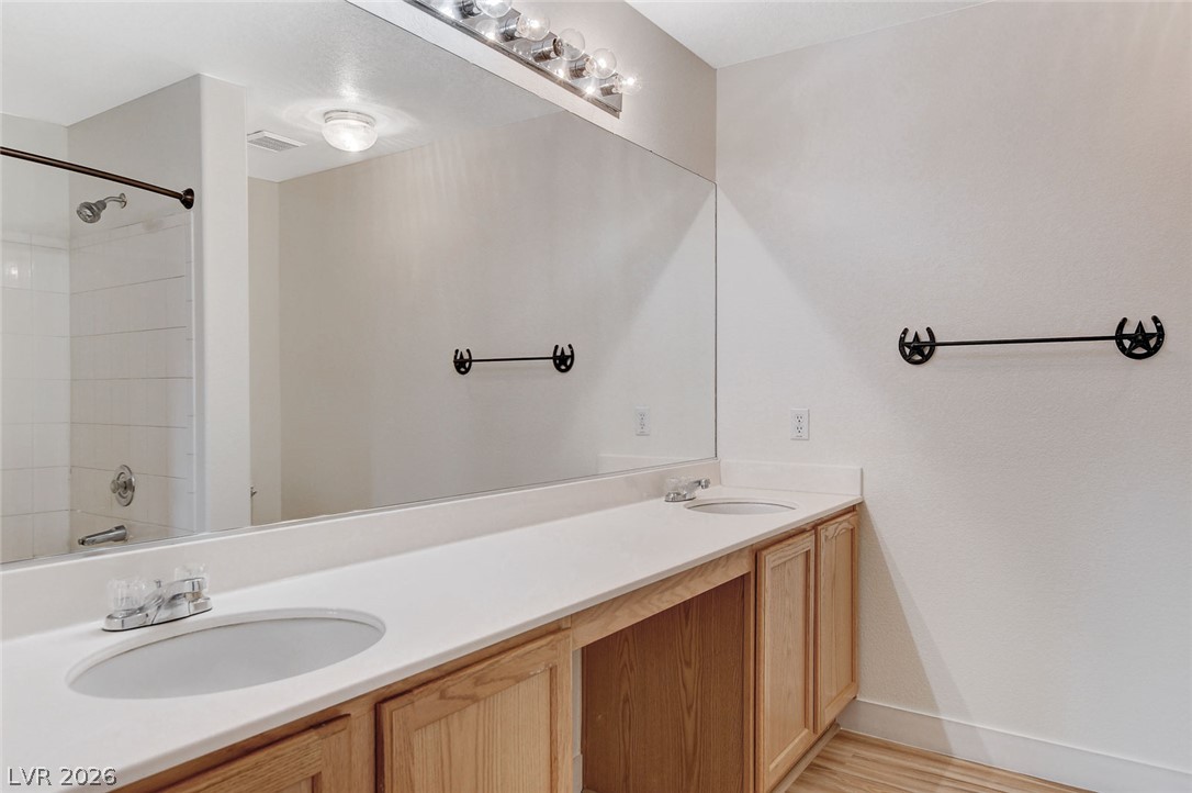 2052 Quarry Ridge Street, Unit 201 Las Vegas, NV 89117 - Photo 19 of 25 Double vanity with ample counter space and convenient towel bar.