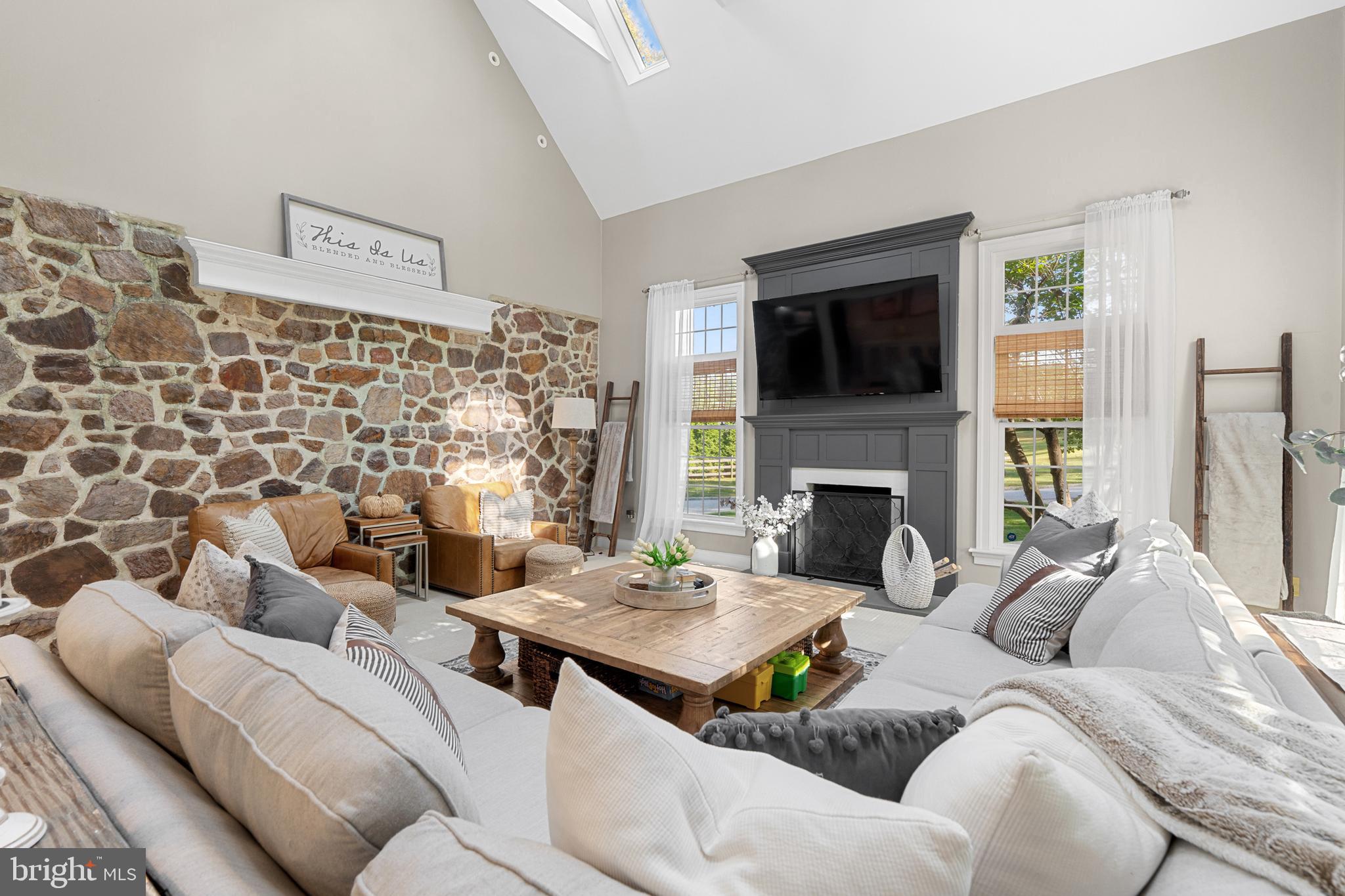 1141 Lafayette Road Wayne, PA 19087 - Photo 12 of 64 a living room with furniture fireplace and flat screen tv