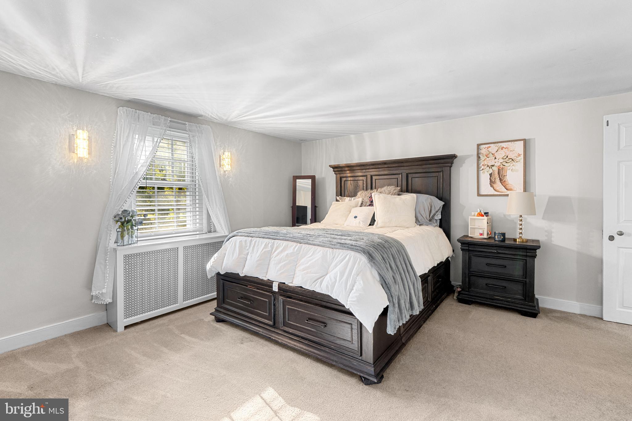 1141 Lafayette Road Wayne, PA 19087 - Photo 31 of 64 a spacious bedroom with a bed and cabinets