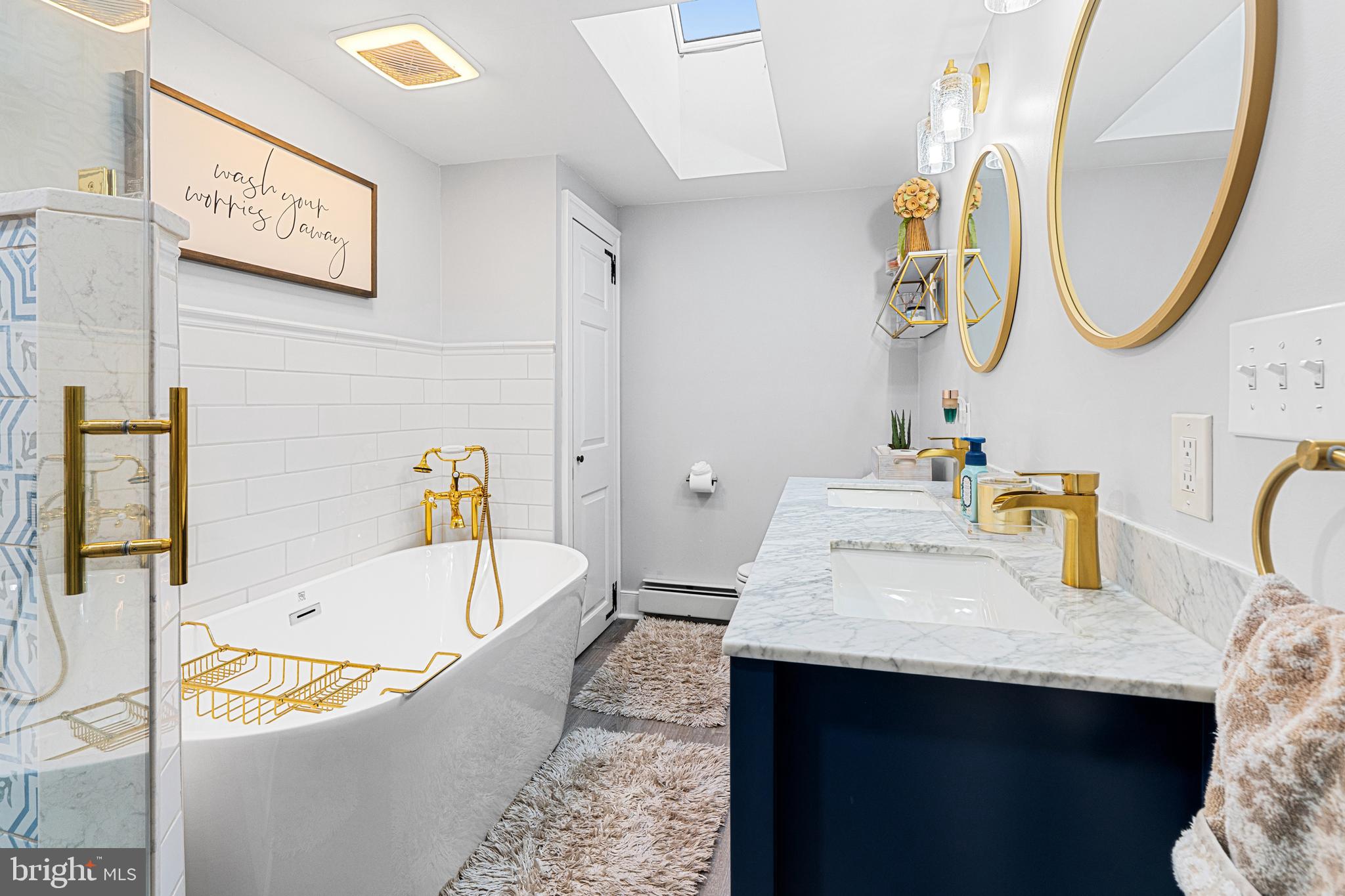 1141 Lafayette Road Wayne, PA 19087 - Photo 33 of 64 a bathroom with a tub sink and mirror