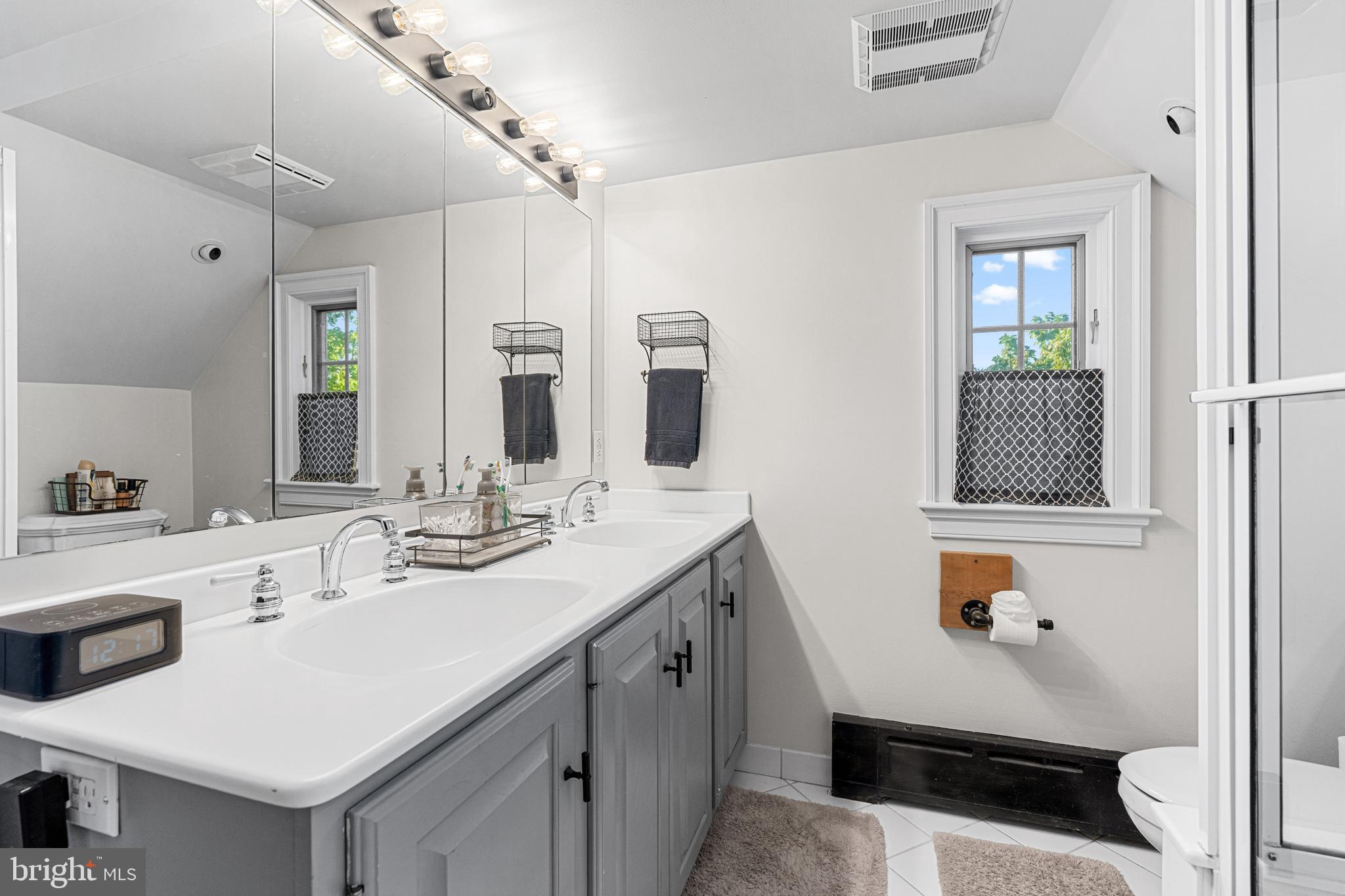 1141 Lafayette Road Wayne, PA 19087 - Photo 39 of 64 a bathroom with a sink double vanity granite and a shower