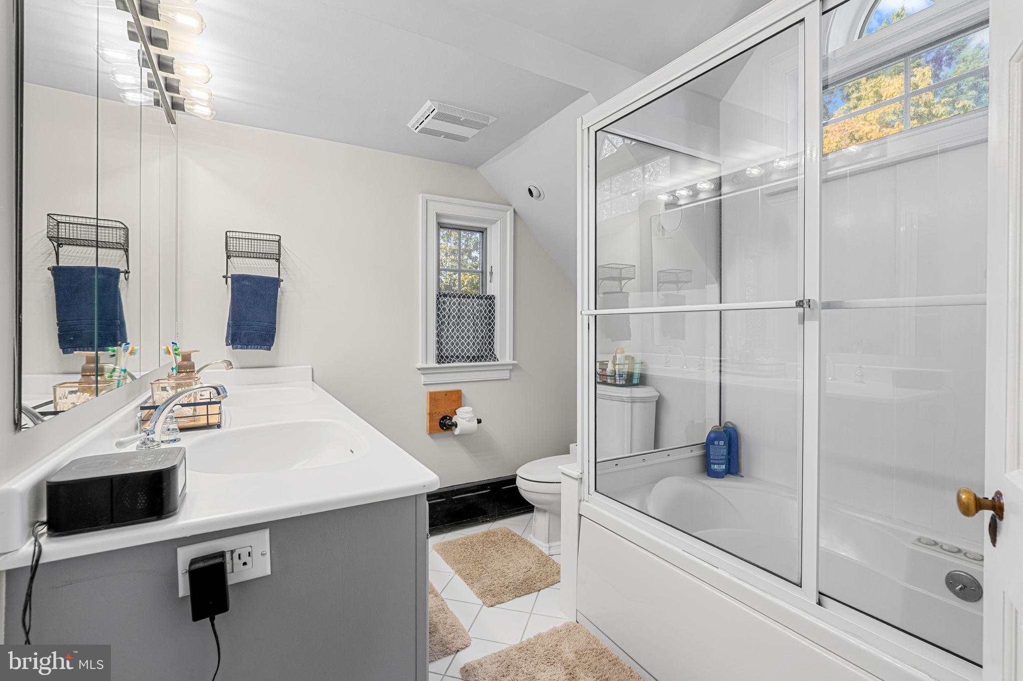 1141 Lafayette Road Wayne, PA 19087 - Photo 40 of 64 a bathroom with a tub sink toilet and mirror