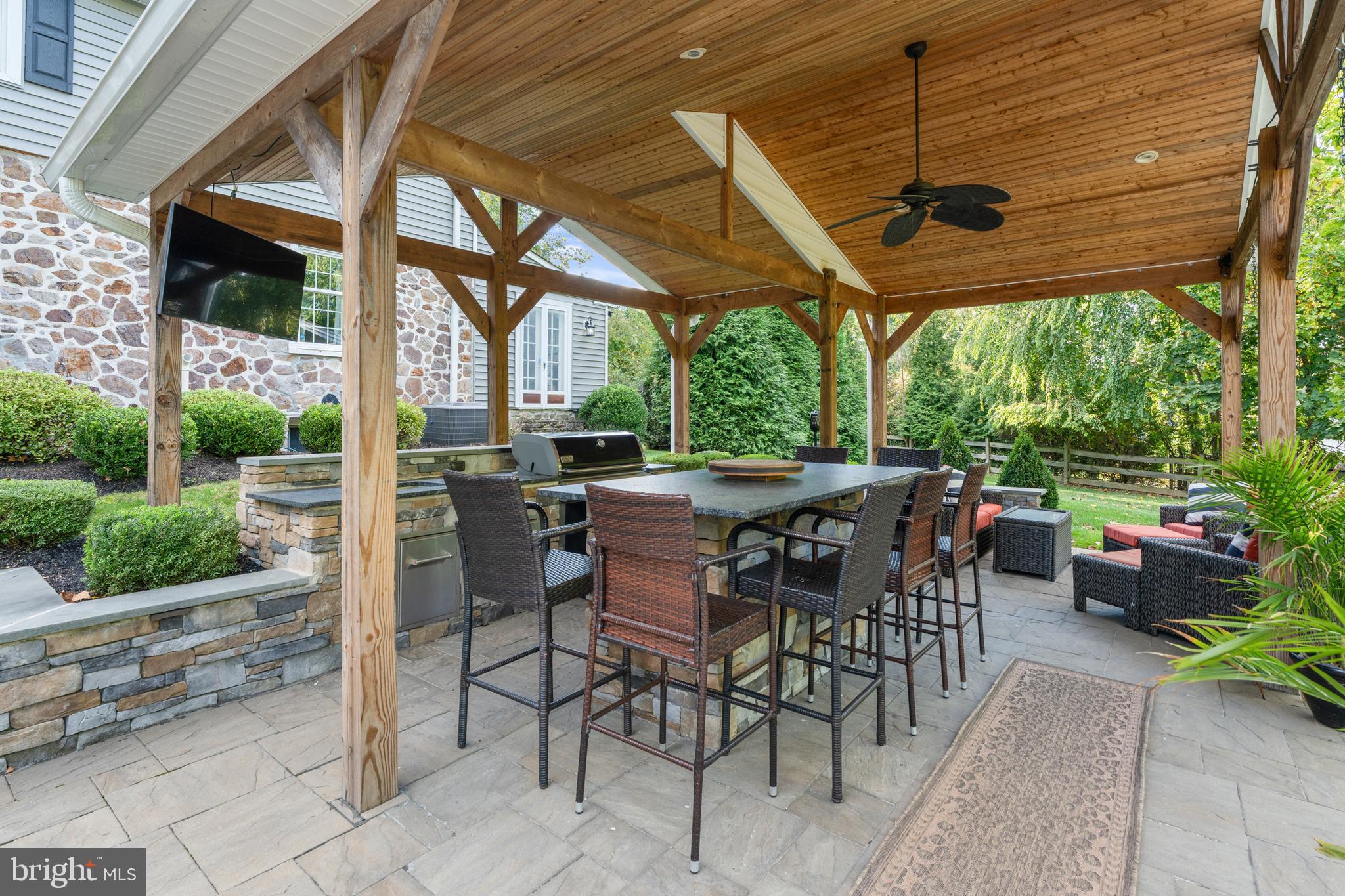1141 Lafayette Road Wayne, PA 19087 - Photo 45 of 64 a view of a patio with a table chairs and a backyard
