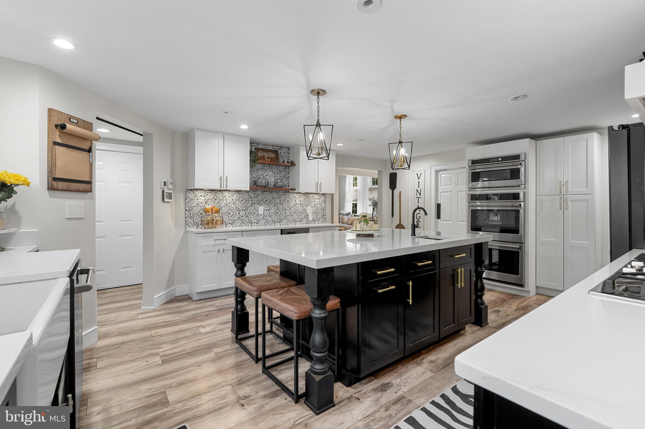 1141 Lafayette Road Wayne, PA 19087 - Photo 7 of 64 a kitchen with kitchen island a cabinets counter and a sink