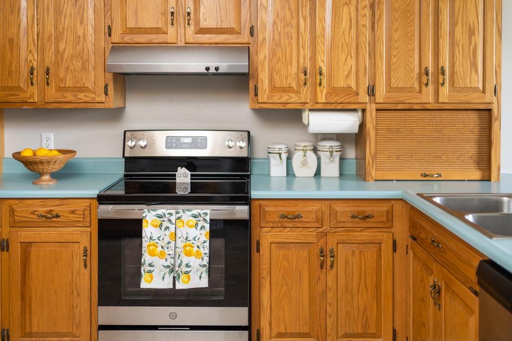 88 Cranberry Drive Stuarts Draft, VA 24477 - Photo 21 of 67 a kitchen with stainless steel appliances granite countertop a stove and cabinets