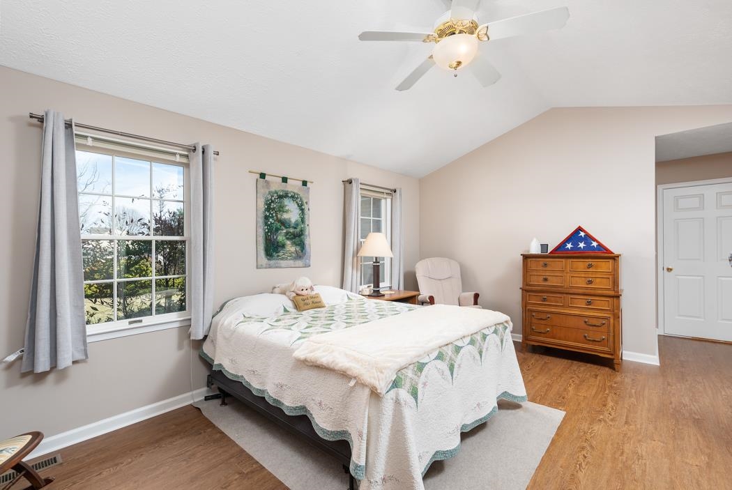 88 Cranberry Drive Stuarts Draft, VA 24477 - Photo 34 of 67 a bedroom with a bed and a chandelier