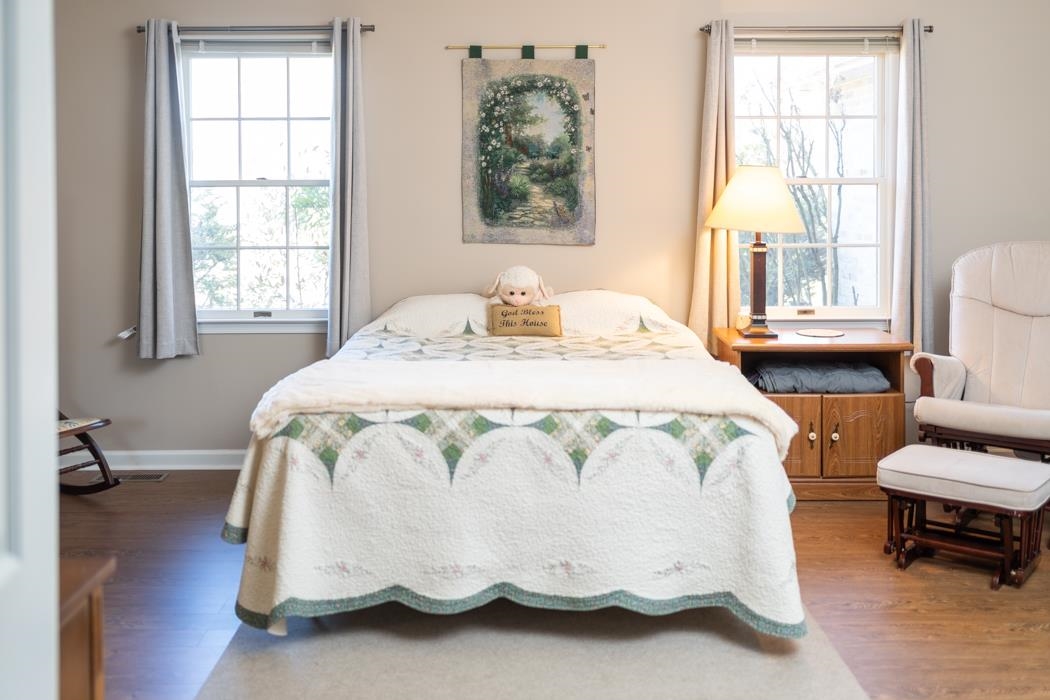 88 Cranberry Drive Stuarts Draft, VA 24477 - Photo 36 of 67 a bed sitting in a bedroom next to a window