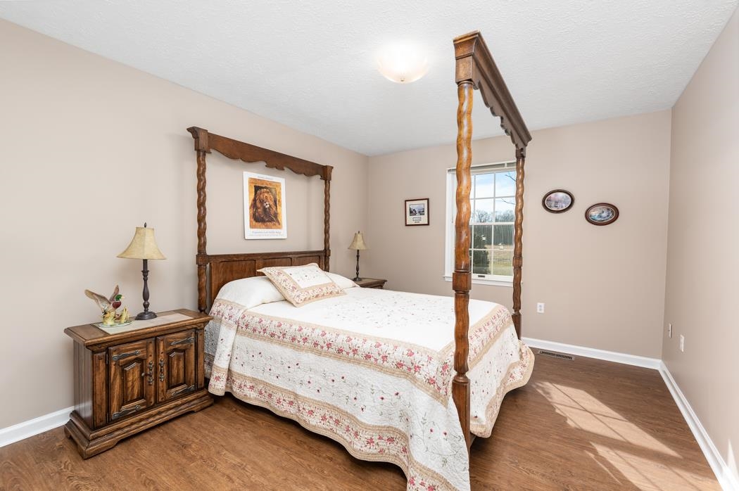 88 Cranberry Drive Stuarts Draft, VA 24477 - Photo 41 of 67 a bedroom with a bed and a window