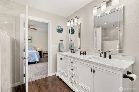 a en suite bathroom with double sink and a mirror