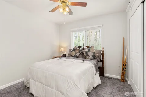 a bed room with a bed and a chandelier