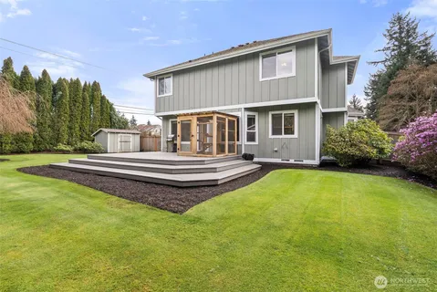 a front view of a house with swimming pool having outdoor seating