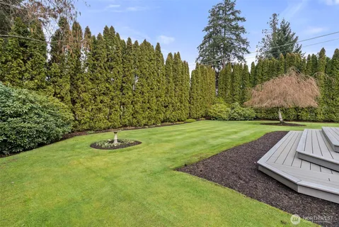 a view of swimming pool with a yard